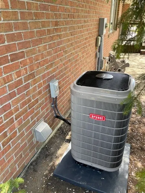 HVAC unit outside a home providing efficient heating and cooling, showcasing Lochard HVAC, Plumbing & Service's installation and maintenance services, including air conditioning, furnace repair, energy-efficient HVAC systems, and professional HVAC services for residential homes in Piqua and surrounding areas. Lochard HVAC, Plumbing & Service offers expert HVAC services, including heating and cooling system installation, air conditioning repair, furnace service, HVAC maintenance, energy-efficient HVAC systems, ductwork installation, HVAC troubleshooting, AC replacement, heater repair, commercial HVAC services, HVAC upgrades, emergency HVAC repair, and indoor air quality solutions. They specialize in both residential and commercial HVAC services, providing reliable solutions for temperature control, air conditioning service, furnace installation, and comprehensive HVAC system care throughout Piqua, Troy, Sidney, Bellefontaine, Celina, Wapakoneta, St. Marys, Tipp City, West Milton, Covington, St. Paris, Versailles, New Bremen, Minster, Anna, Fort Loramie, Russia, Jackson Center, Indian Lake, Bradford, Botkins, Degraff, Quincy, Houston, Casstown, and Kettlersville.
