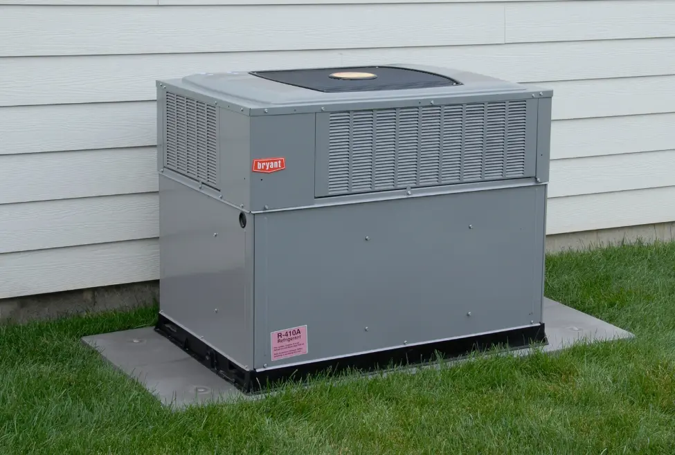 HVAC unit outside a residential home, representing common air conditioner noises, AC repair services, strange AC sounds, and air conditioning diagnostics provided by Lochard HVAC, Plumbing, and Service, including AC inspection, AC maintenance, and residential cooling solutions. Contact us today for help with AC making noise, is it normal for AC to be loud, strange noises from air conditioner, buzzing sound from AC unit, rattling AC noise, air conditioner making banging sound, HVAC noise issues, AC making humming noise, noisy air conditioning unit, air conditioner sounds like it's running loud, AC unit noise troubleshooting, loud HVAC system, air conditioner repair near me, HVAC repair near me, emergency AC repair near me, residential AC repair services, AC maintenance near me, HVAC technician near me, noisy AC repair, Lochard HVAC noise inspection, air conditioner tune-up, AC unit making clicking noise, fix loud air conditioner, why is my AC making a weird noise, HVAC repair services, air conditioning services near me, HVAC diagnostics and repair, cooling system inspection, Lochard air conditioning service.