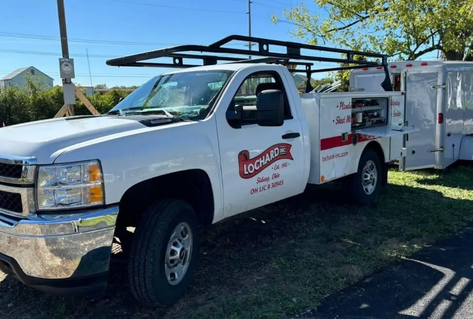 Lochard HVAC, Plumbing & Service branded vehicle showcasing our commitment to providing expert HVAC and plumbing services in Versailles. Specializing in furnace and air conditioning installation, repair, plumbing repairs, water conditioning, and indoor air quality solutions for homeowners and businesses. We provide HVAC services in Versailles, plumbing services in Versailles, heating repair near me, air conditioning installation Versailles, furnace service Versailles, plumbing repair Versailles, water heater installation Versailles, emergency plumbing services near me, indoor air quality solutions Versailles, geothermal heating systems Versailles, HVAC maintenance Versailles, ductless mini-split installation Versailles, drain cleaning services Versailles, gas line repair Versailles, water conditioning systems Versailles, commercial HVAC services Versailles, plumbing installation Versailles, air conditioning repair Versailles, furnace installation Versailles, WiFi thermostat installation Versailles.