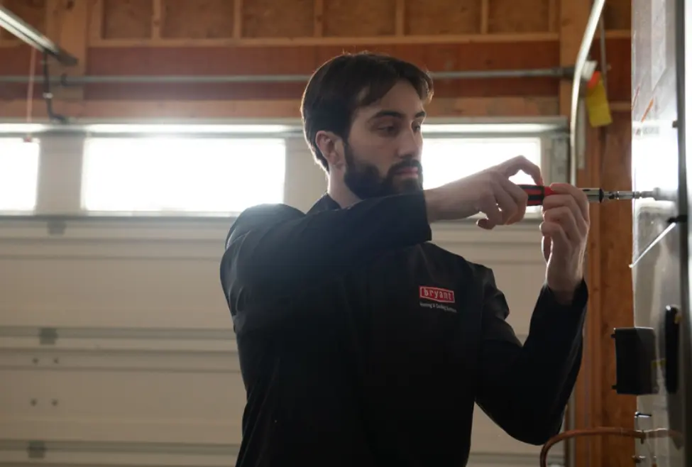 A residential furnace making loud noises, illustrating common issues like a failing blower motor or loose components, with expert furnace repair and HVAC maintenance by Lochard HVAC, Plumbing, and Service to address why a furnace is making a lot of noise. Call us now for help with why is my furnace making a lot of noise, furnace making loud noises, noisy furnace repair, furnace blower motor noise, furnace rattling, furnace humming, furnace banging, furnace squealing, furnace knocking, furnace vibration issues, furnace maintenance, furnace tune-up, HVAC repair, furnace repair near me, HVAC service near me, emergency furnace repair, heating system noise, furnace not working properly, furnace noise troubleshooting, furnace service, furnace inspection, furnace repair services near me, furnace repair company, heating system maintenance, HVAC contractor near me, furnace diagnostic services.