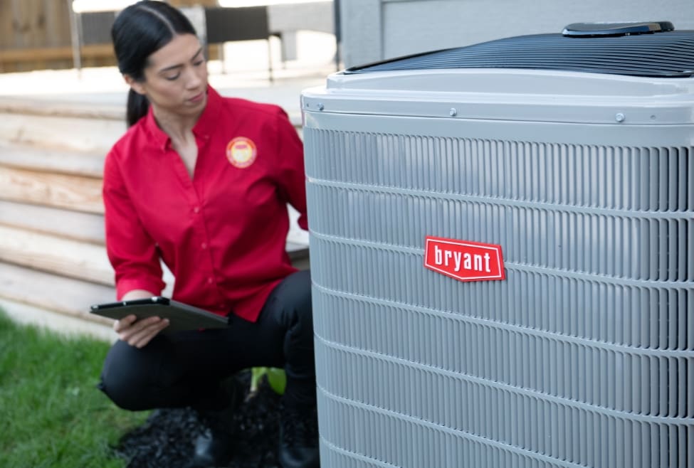 Air conditioner outside a home, representing how long an AC unit lasts and maintenance tips from Lochard HVAC, Plumbing, and Service, including AC replacement, repair, and installation. Trust us to help you with how long does an AC unit last, AC lifespan, average life of an air conditioner, signs you need a new AC, AC replacement cost, when to replace your air conditioner, air conditioner maintenance, AC repair services, AC installation services, residential AC services, commercial AC services, high-efficiency air conditioners, central air replacement, ductless mini-split systems, heat pump replacement, HVAC service near me, AC repair near me, AC replacement near me, air conditioner maintenance near me, emergency AC repair near me.