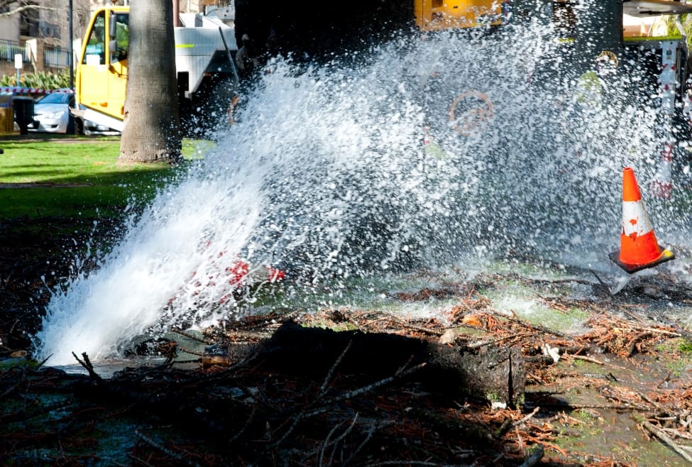 A burst pipe spraying water outside a home, showing emergency plumbing repair needed, burst pipe water damage issues, and urgent leak repair services by Lochard HVAC, Plumbing, and Service. Contact us today for help with is a burst pipe an emergency, burst pipe repair, emergency plumbing services, plumbing leak repair, water pipe burst, pipe burst repair, leaking pipe fix, burst water line, plumbing emergency near me, emergency plumber near me, home water damage repair, frozen pipe burst, pipe repair services, water leak detection, plumbing services near me, residential plumbing repair, urgent plumbing repair, broken pipe replacement, pipe leak repair, pipe burst cleanup.