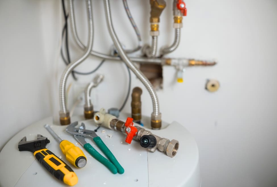 A professional plumber from Lochard HVAC, Plumbing, and Service performing plumbing work, highlighting reasons why hiring a plumber can be expensive, including expert faucet installation, pipe repair, drain cleaning, and water line services. Contact us today for help with why is hiring a plumber so expensive, plumbing service costs, plumber rates, plumber prices, local plumbers near me, emergency plumber near me, residential plumbing services, commercial plumbing services, drain cleaning service, pipe repair service, water line installation, faucet installation cost, toilet installation cost, unclog drain service, plumbing maintenance near me, affordable plumbing services, licensed plumber near me, plumbing repair estimates, water heater installation, tankless water heater service, plumbing inspection near me.