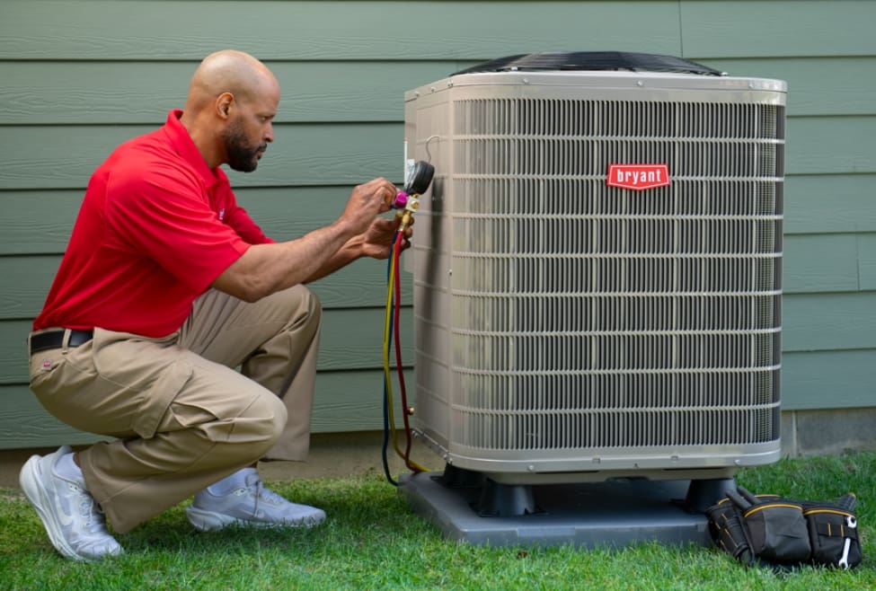 Outdoor air conditioning unit showing AC system components affected by low refrigerant, including poor cooling performance, refrigerant leak symptoms, and HVAC diagnostics by Lochard HVAC, Plumbing, and Service. Reach out to us today for help with how do I tell if my AC is low on refrigerant, signs of low refrigerant in AC, AC refrigerant leak symptoms, AC blowing warm air refrigerant issue, frozen evaporator coil low refrigerant, AC not cooling refrigerant problem, HVAC refrigerant recharge service, AC refrigerant leak repair, air conditioning refrigerant service, central AC low freon symptoms, air conditioner troubleshooting cooling issues, AC compressor strain low refrigerant, refrigerant leak detection service, HVAC repair, air conditioning repair, AC maintenance service, HVAC diagnostic service, emergency AC repair, AC service near me, AC repair near me, HVAC service near me, refrigerant leak repair near me, AC maintenance near me, air conditioning technician near me, cooling system repair near me, residential AC repair near me, HVAC company near me.